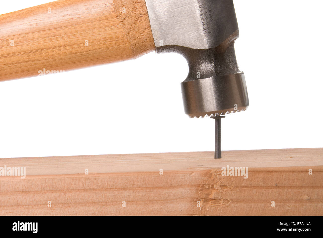 Nail being hammered into wood Stock Photo Alamy