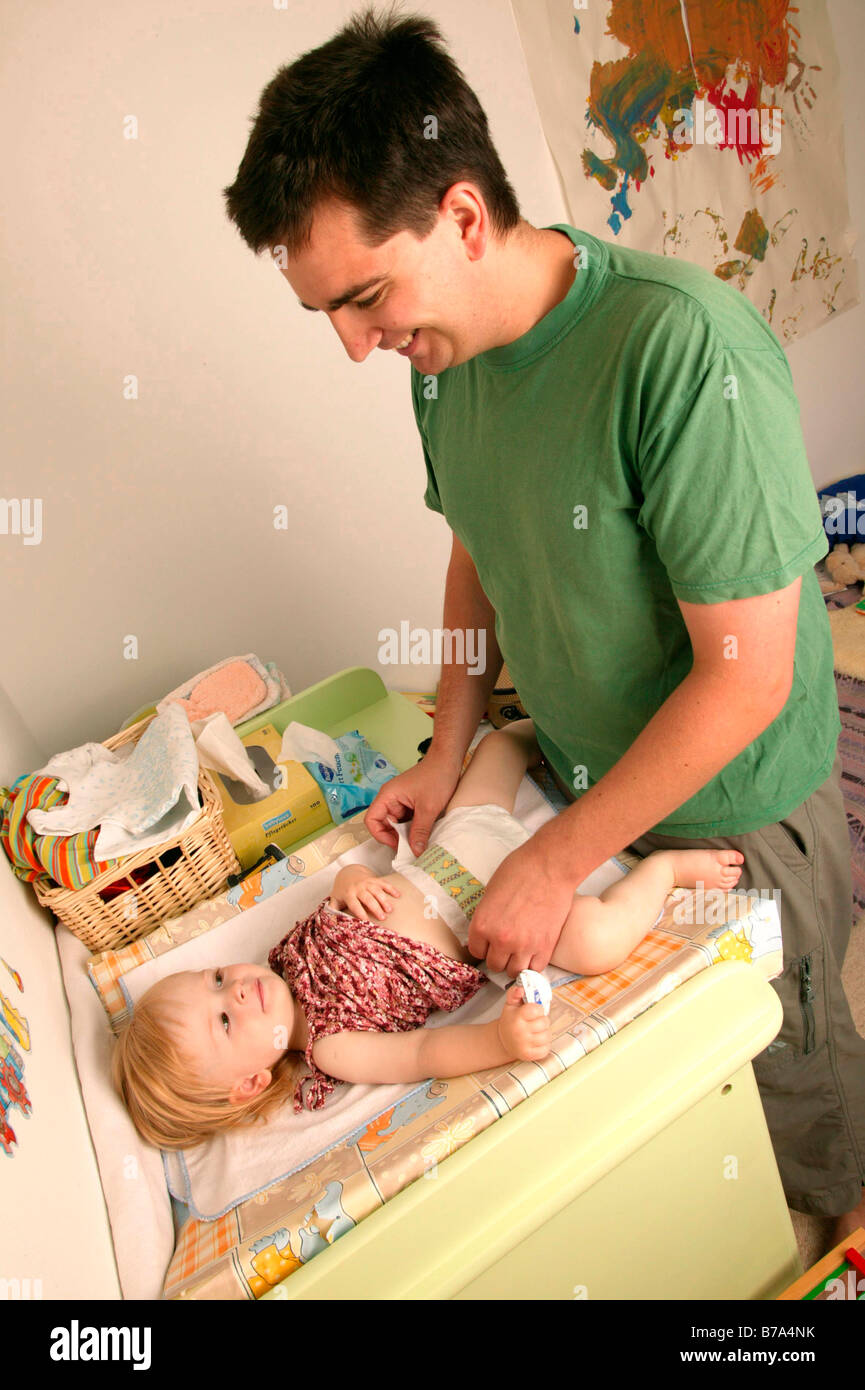 Father changing a baby's nappy Stock Photo Alamy