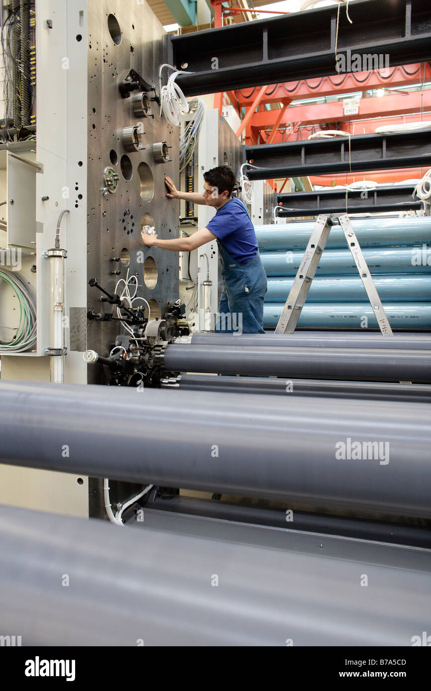 Laborer cleaning the impression cylinders of a reel-fed offset printing machine, manufacture, Production MAN Roland Printing Ma Stock Photo