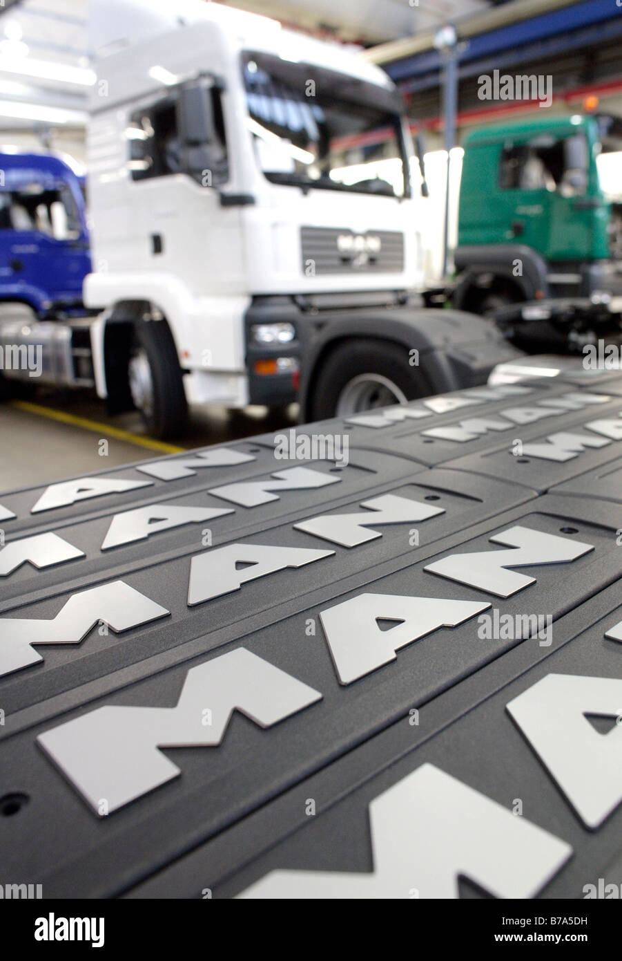 Company logo signs for trucks with a driving cab, manufacture, Production MAN Commercial Vehicle Corporation, Munich, Bavaria,  Stock Photo