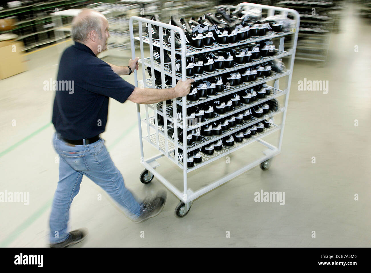 Shoes being transported in a trolley by an employee, production of the football boot, soccer boot, Copa Mundial, Adidas AG Sche Stock Photo