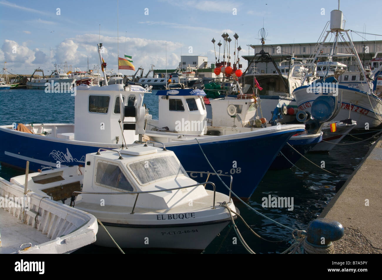 Spanish Commercial Fishing Boats Trawlers Moored At The Quayside in Garrucha Harbour Almeria Spain Stock Photo
