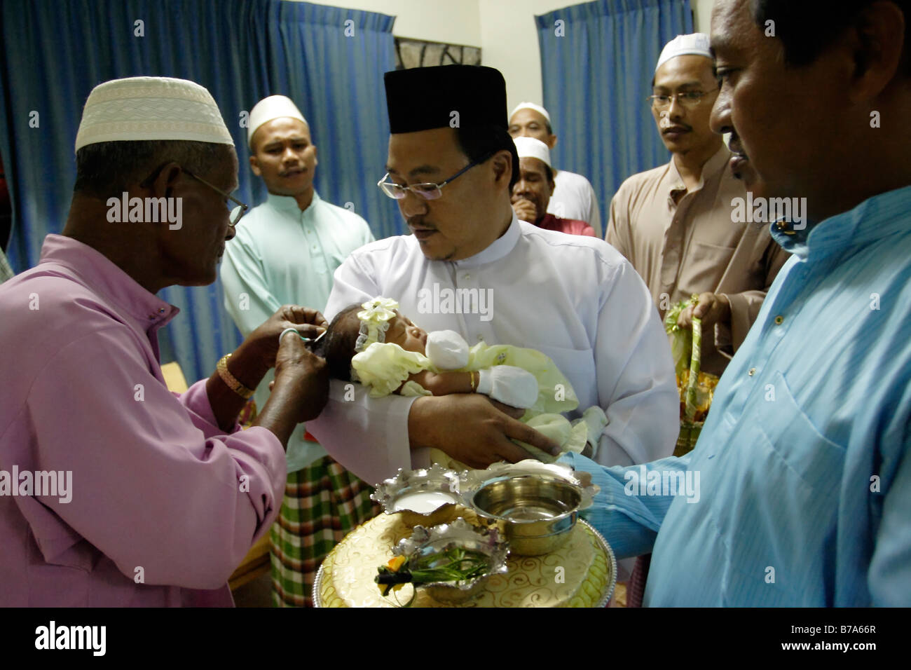 Malay Custom Of Cutting Hair Of A New Born Baby In Terengganu Malaysia Stock Photo Alamy