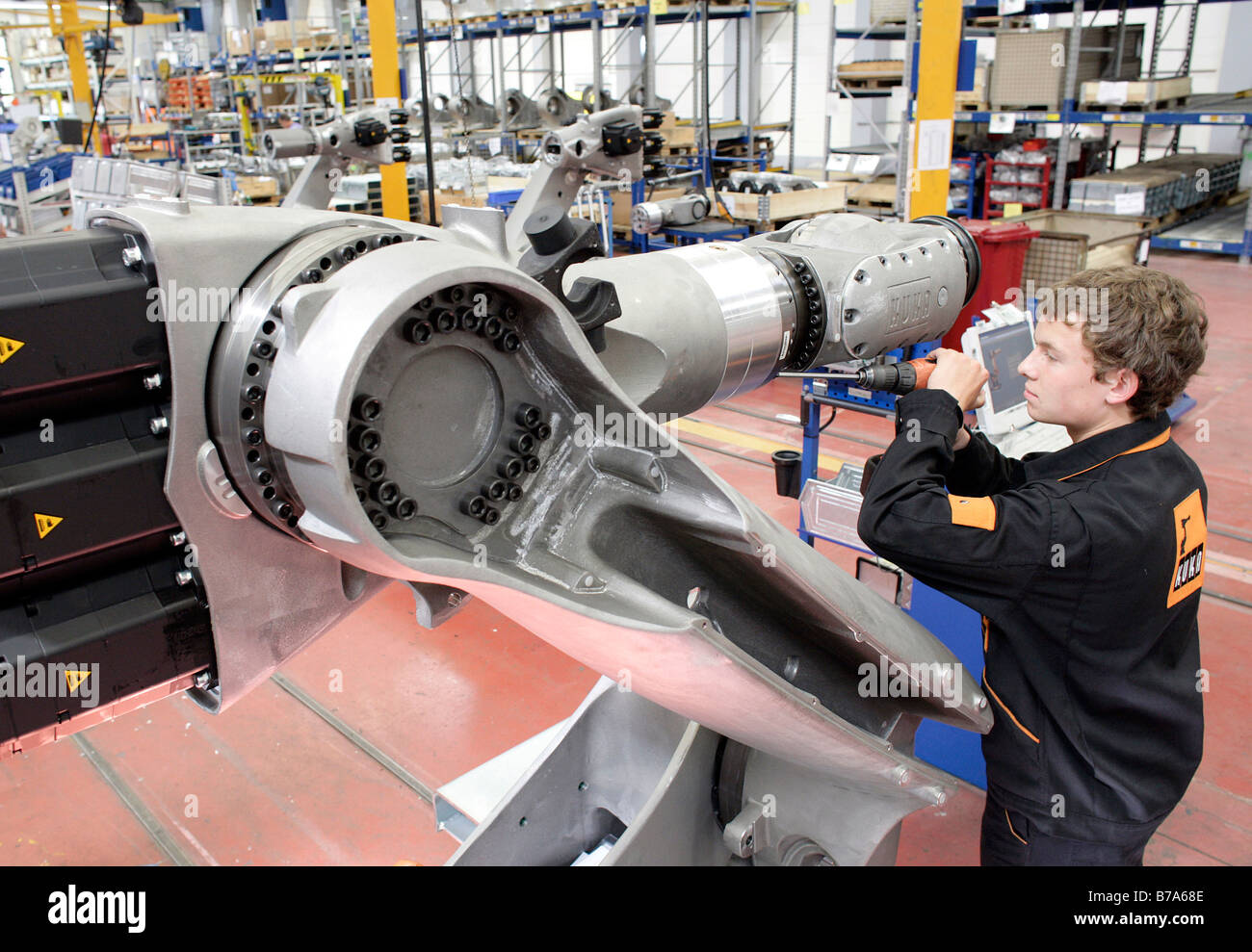 Mechatronics apprentice at the Robot production in the KUKA Roboter GmbH,  responsible for the robotics department of the IWKA A Stock Photo - Alamy