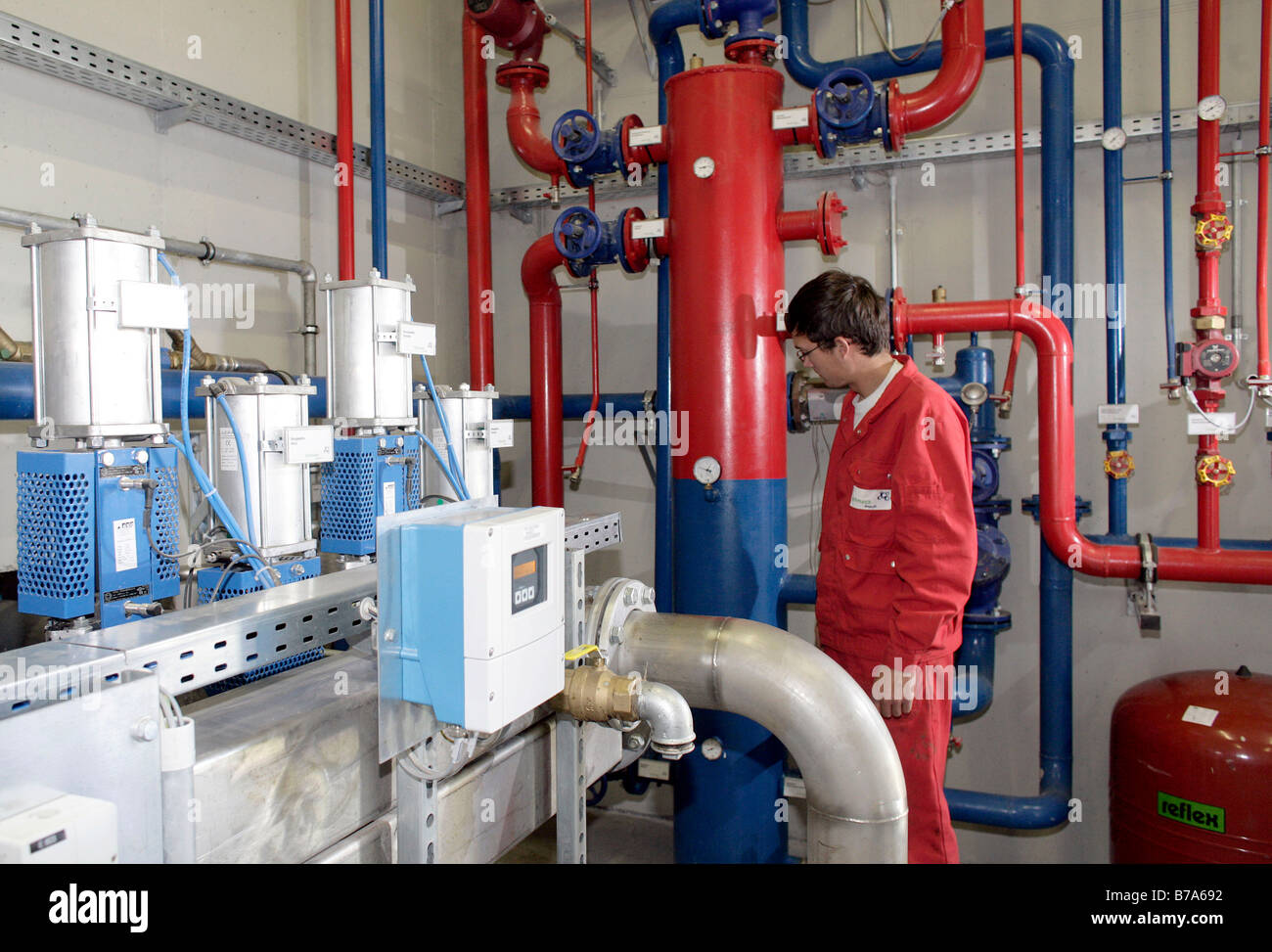 An Employee Of The Schmack Biogas Ag Regulating The Heater Stock Photo Alamy