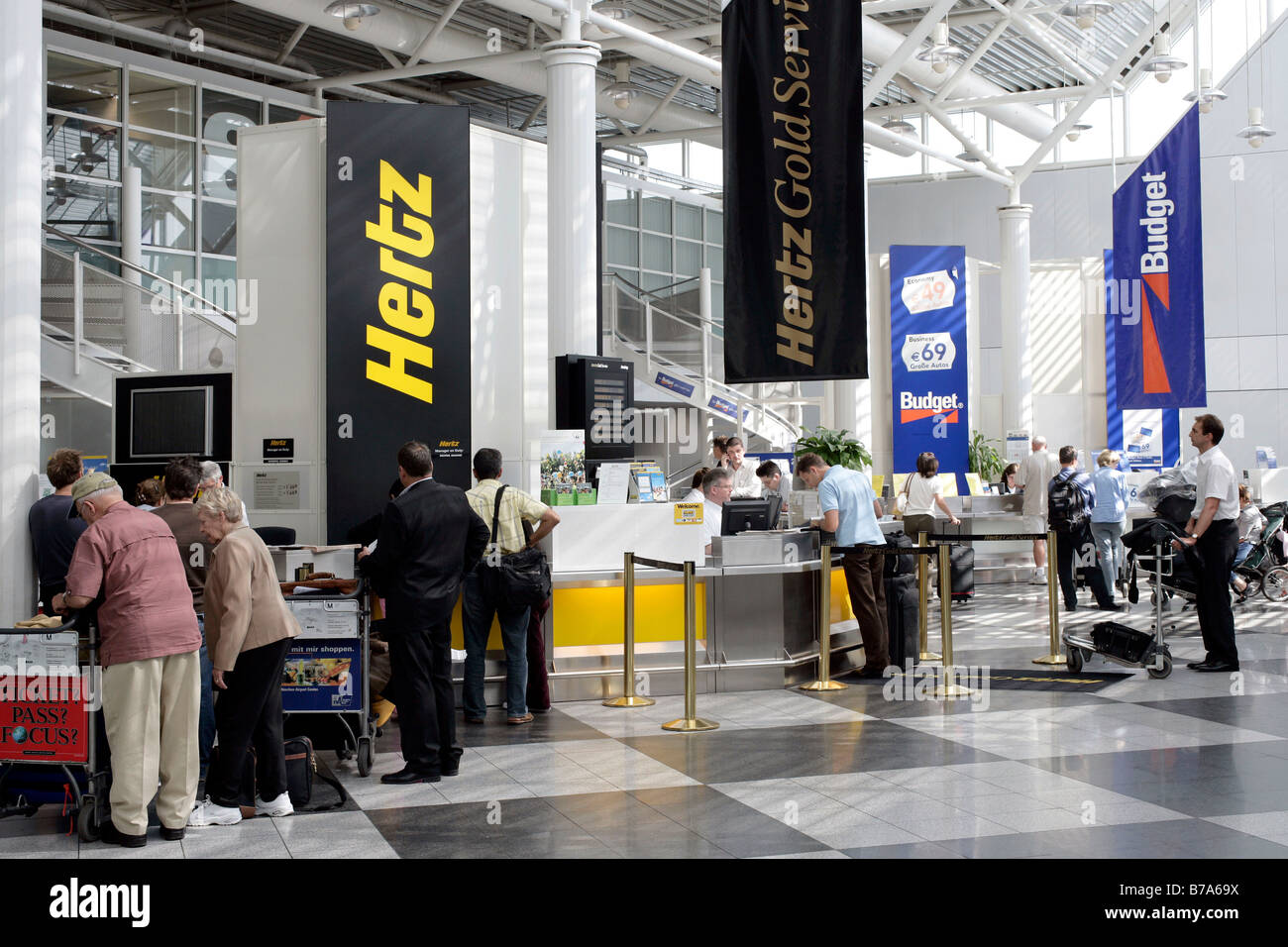 Car Rental Desks of the Hertz and Budget car rental companies in the Munich Airport, Bavaria, Germany, Europe Stock Photo