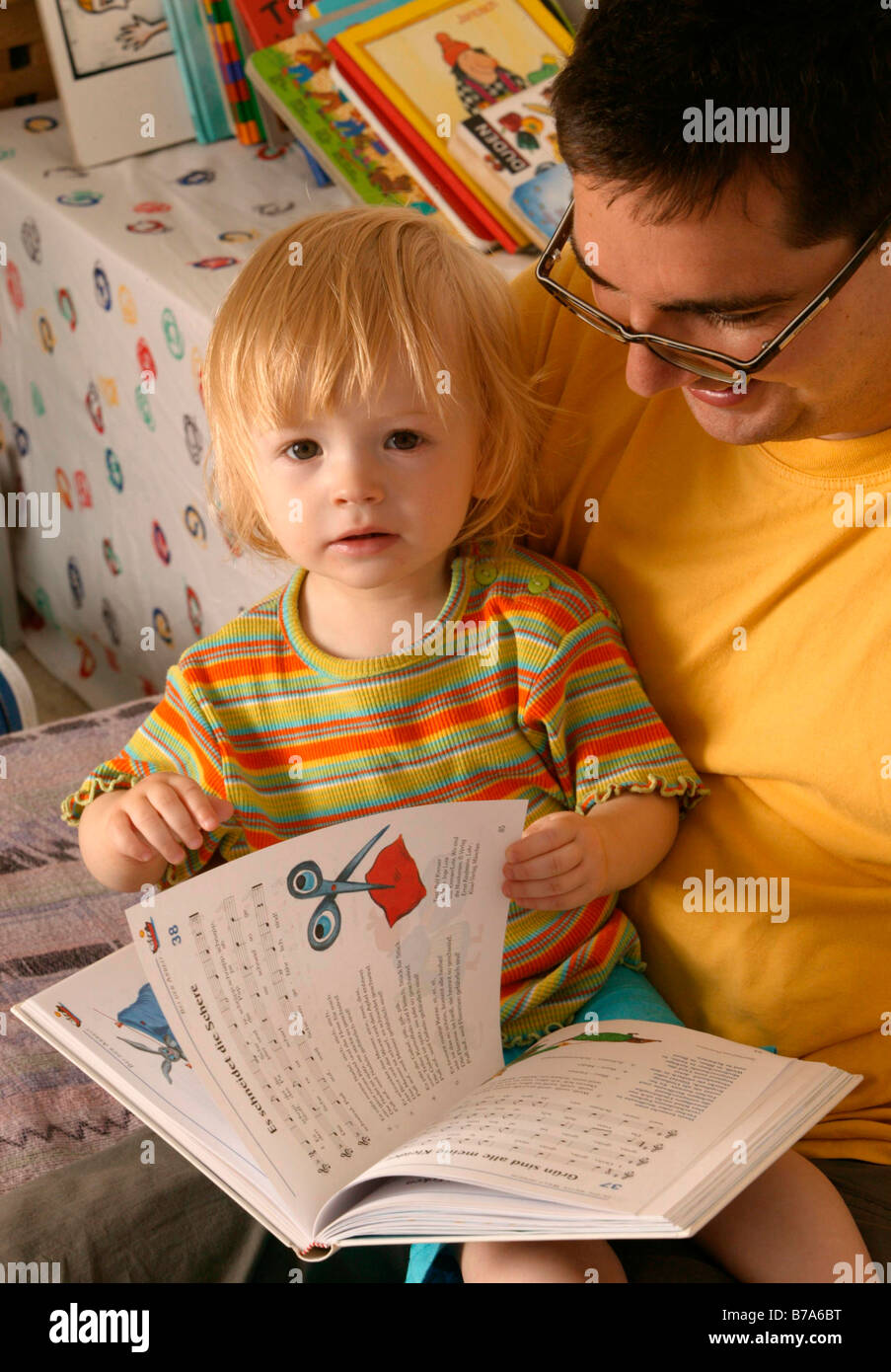 Father reading to his child Stock Photo