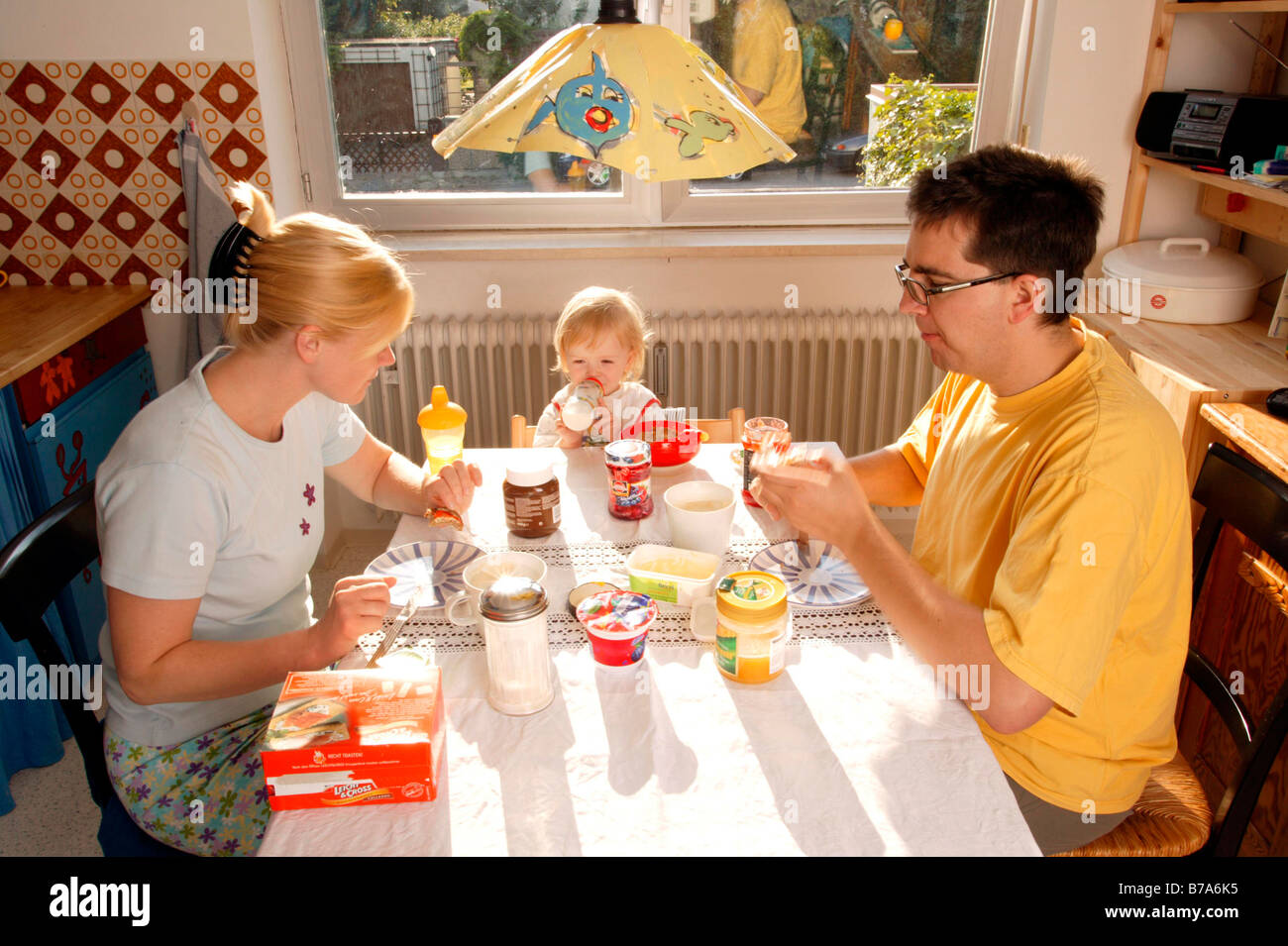 Young family having breakfast Stock Photo