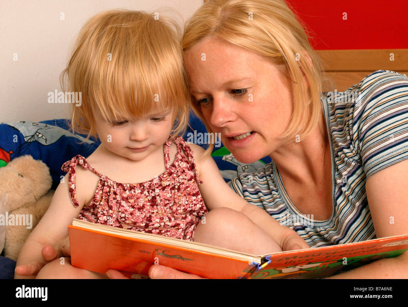 Mother reading to her child Stock Photo