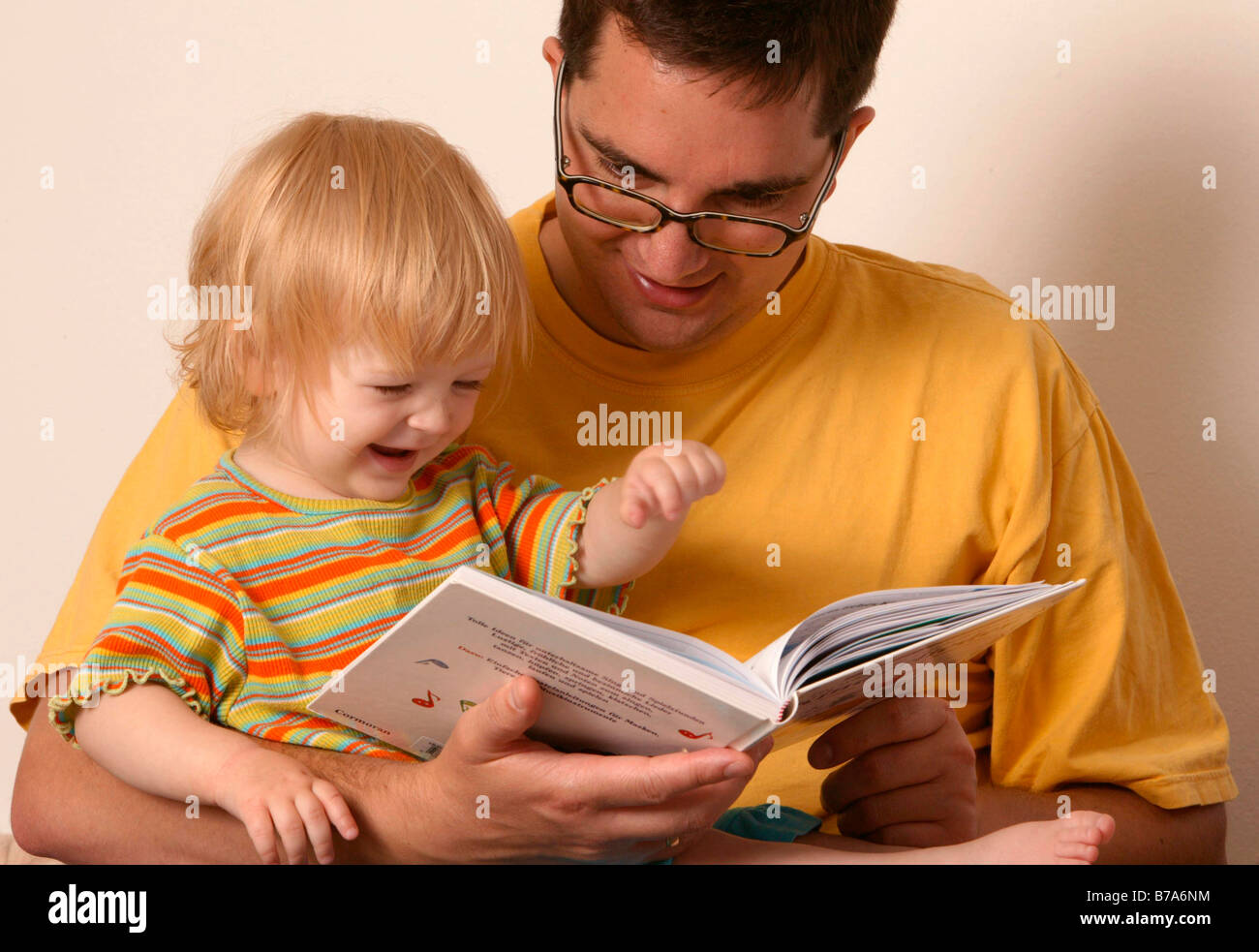 Father reading to his child Stock Photo