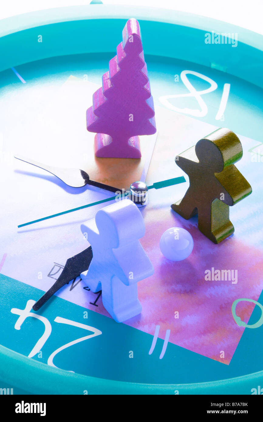 Wooden children figures on clock Stock Photo Alamy