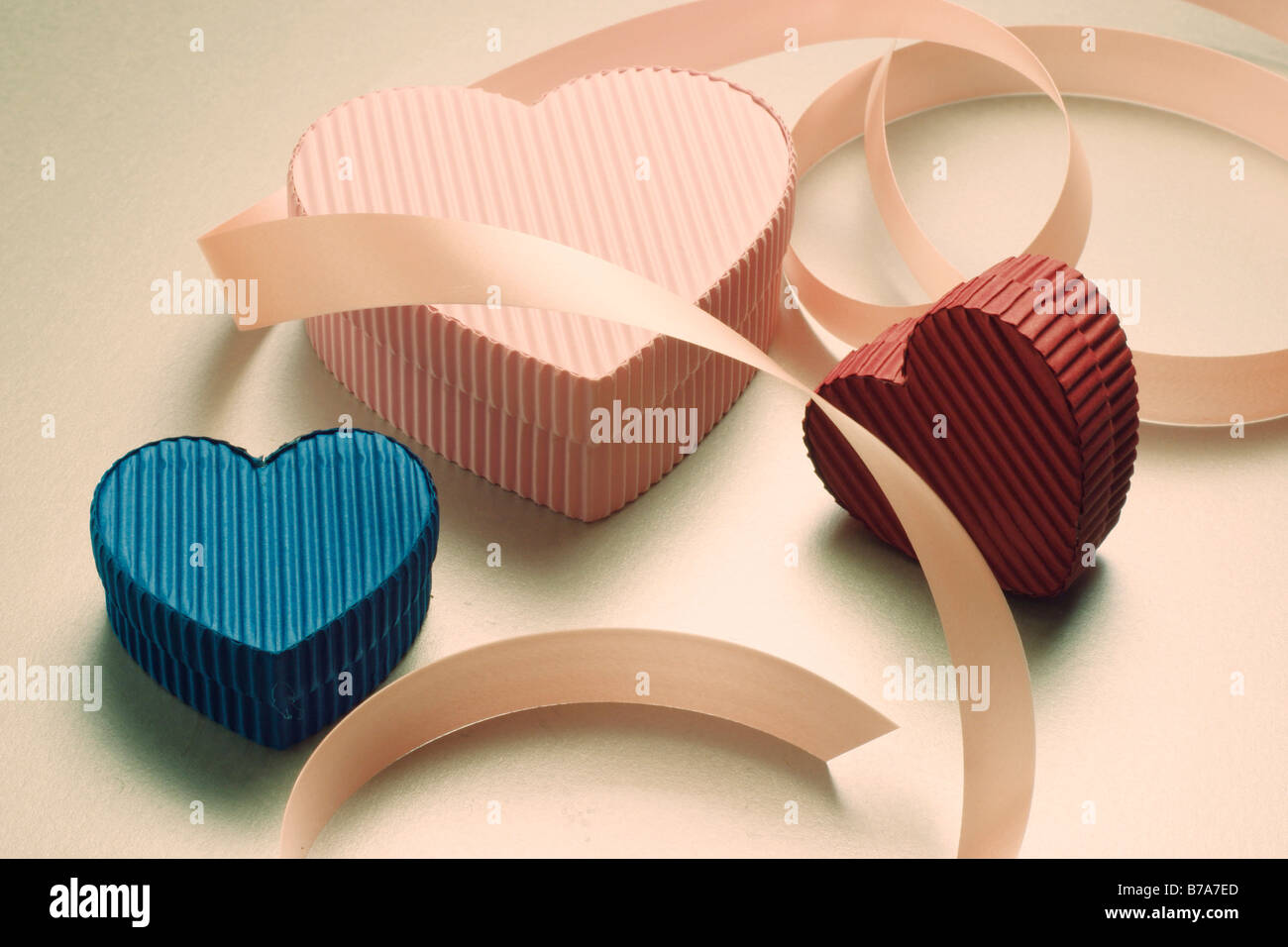 Heart-shaped gift boxes and ribbon Stock Photo