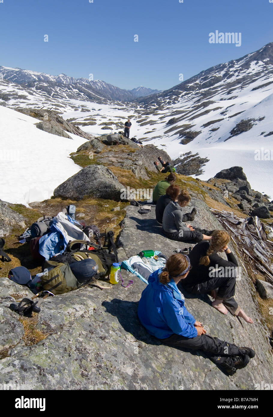 Group of alpinists, relaxing and enjoying the summit panorma, Chilkoot Pass/Trail, Klondike Gold Rush, British Columbia, B.C.,  Stock Photo