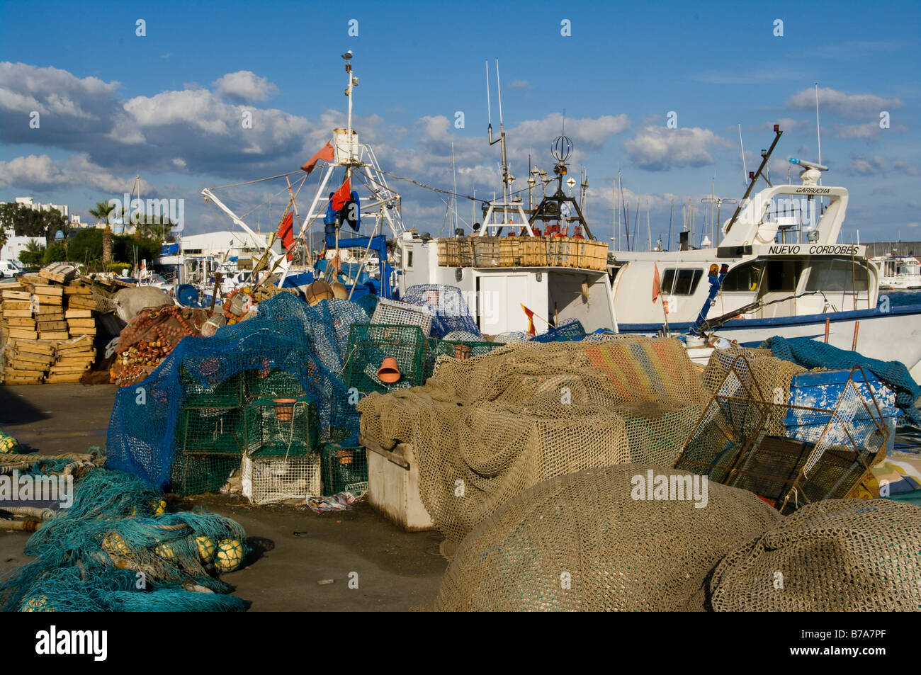 Lobster Pots and Commercial Fishing Nets On The Quayside of Garrucha Harbour Almeria Spain Stock Photo