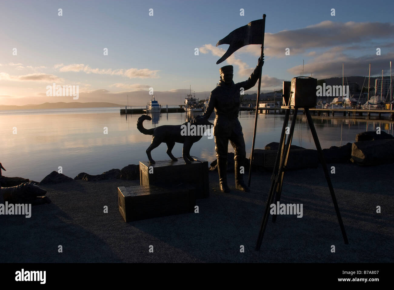 Silhouette of the statue of the Antarctic photographer Frank Hurley, Victoria Dock, Hobart, Tasmania, Australia Stock Photo