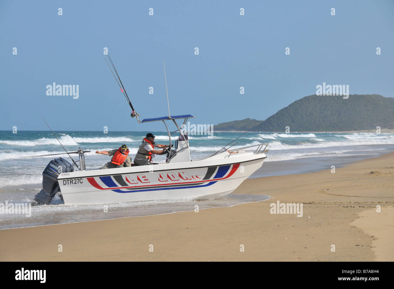 Motor boat with high sea angler, navigating onto the beach, St. Lucia, Greater St. Lucia Wetlands Park, South Africa, Africa Stock Photo