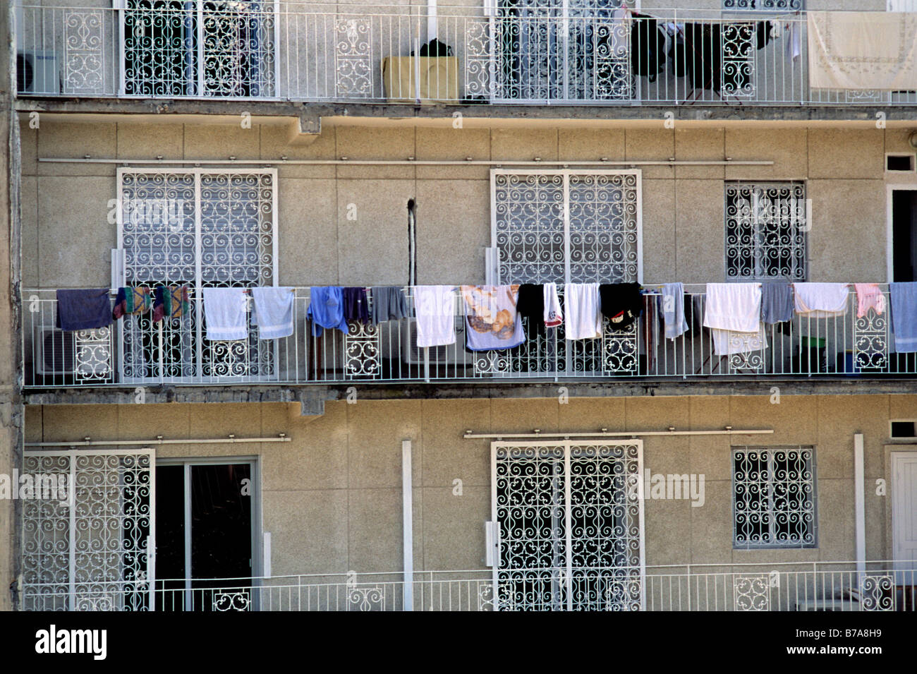 Apartment building in Dakar with laundry draped over the railings of