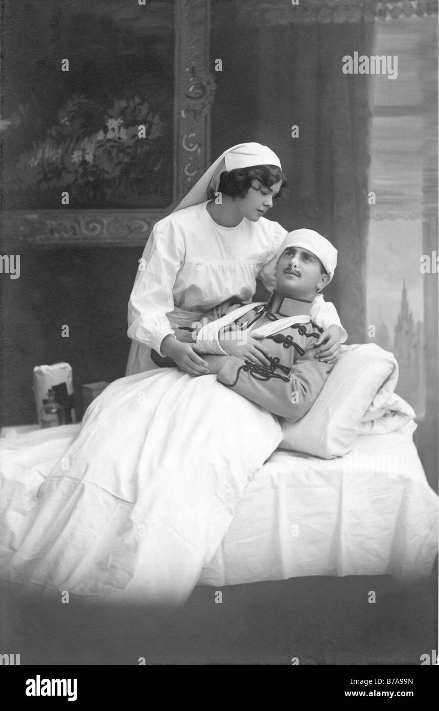 Historical photo, injured soldier and nurse, ca. 1920 Stock Photo