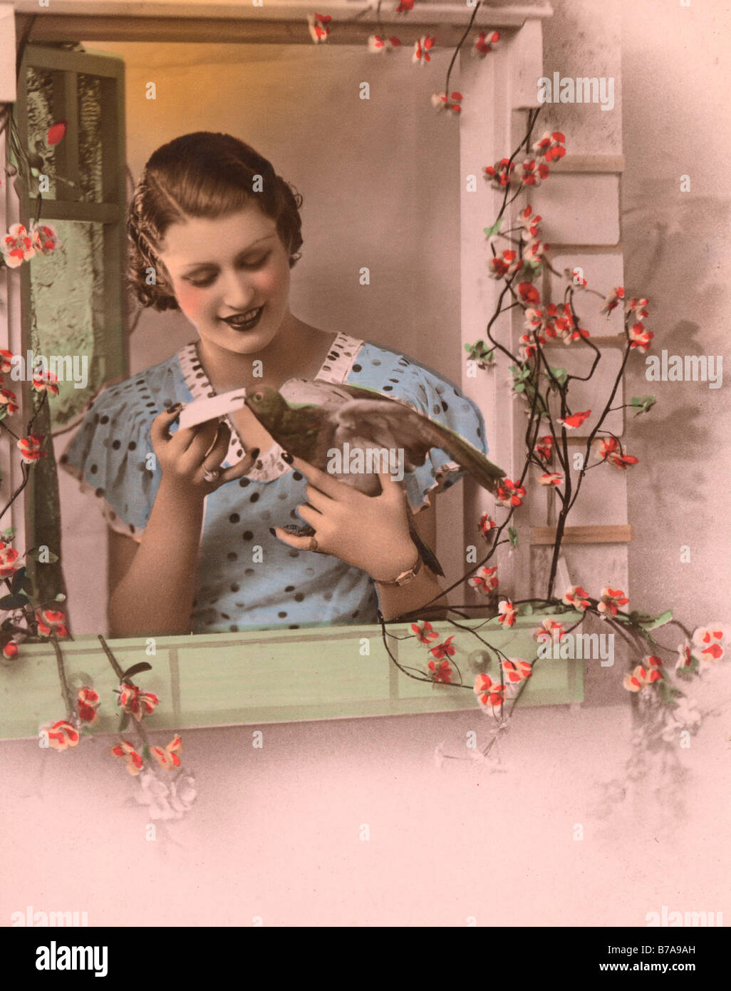 Historical photo, woman with homing pigeon Stock Photo