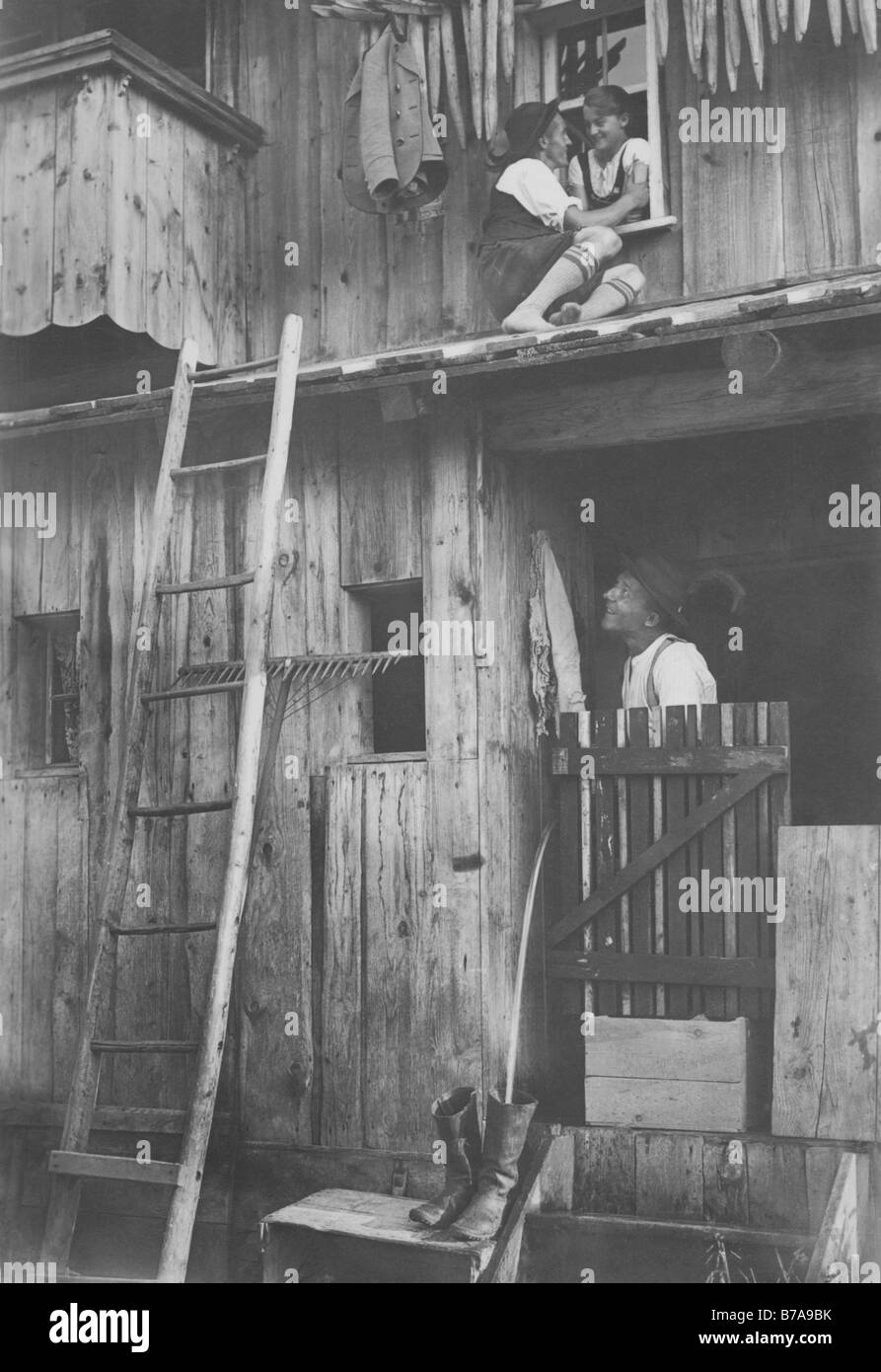 Historic photo, 'Fensterln', man climbing through his sweetheart's window, ca. 1930 Stock Photo