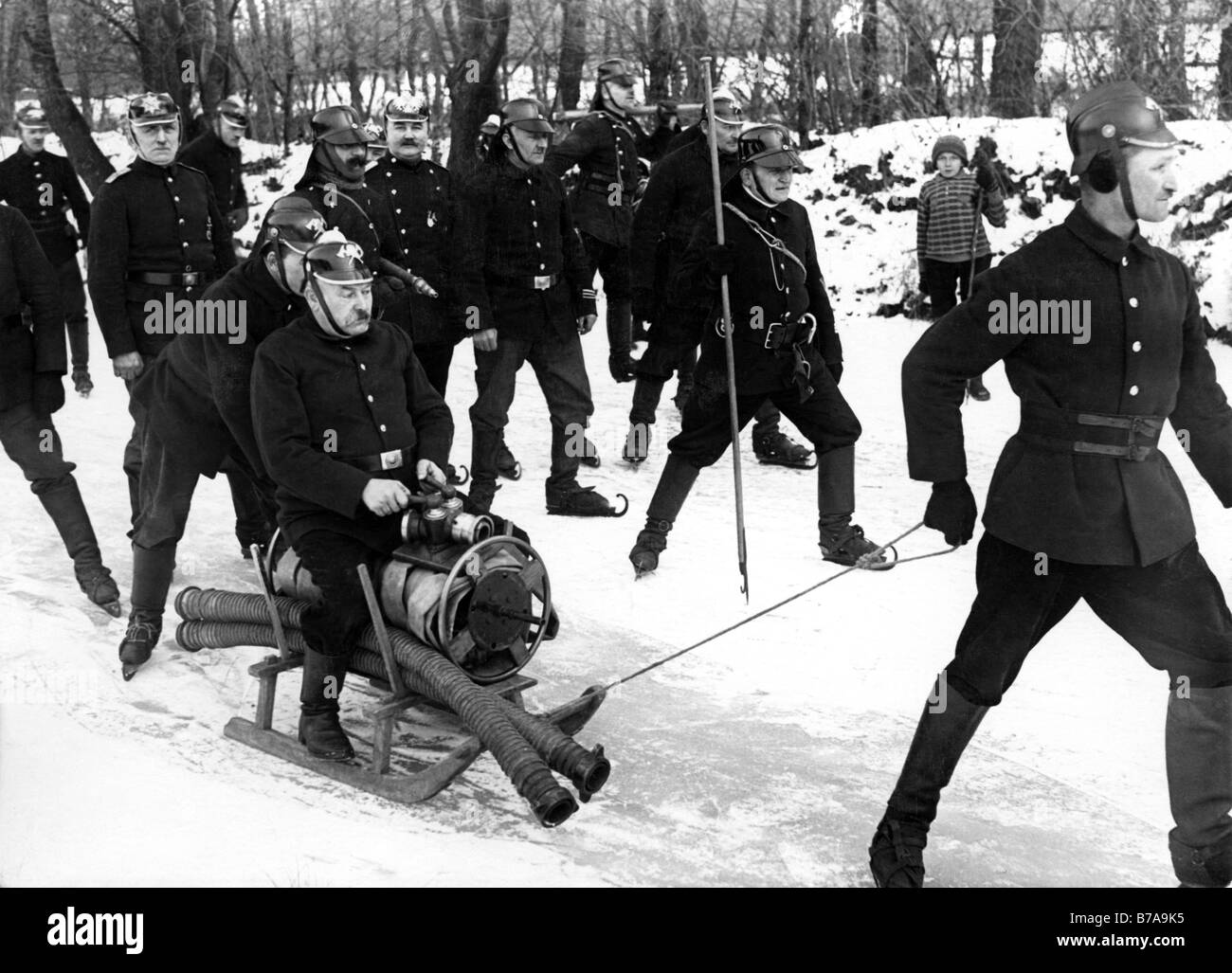 Historic picture, fire brigade with a sledge in ice and snow, taken around 1930 Stock Photo