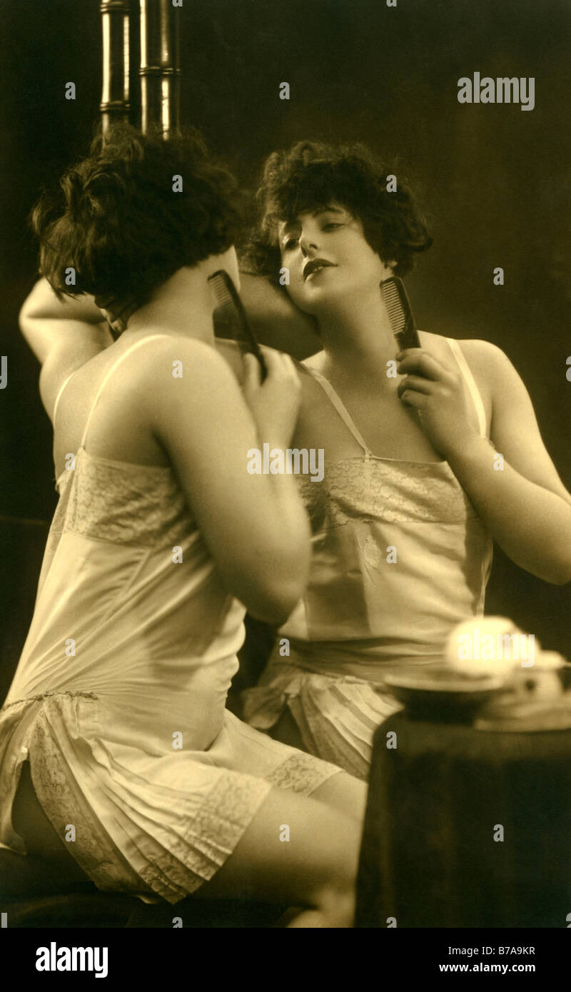 Historic photo, pretty woman in front of the mirror, ca. 1910 Stock Photo