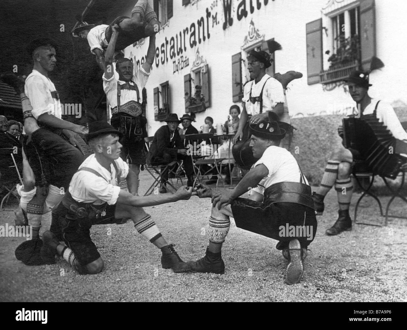 Historic photo, Bavarians doing 'Fingerhakeln', Bavaria, Germany, ca. 1930 Stock Photo