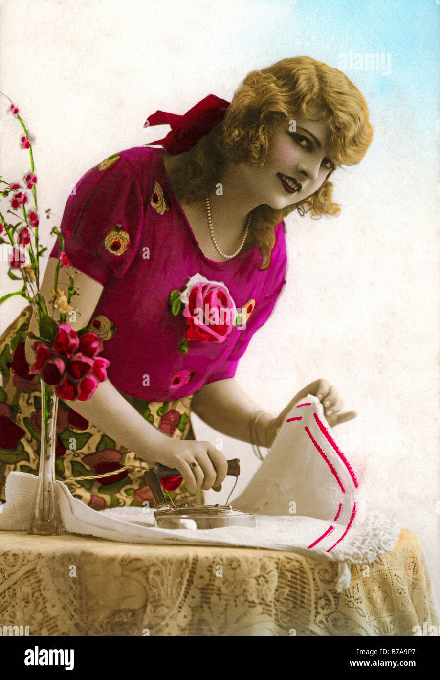 Historic photograph, woman ironing, ca. 1915 Stock Photo