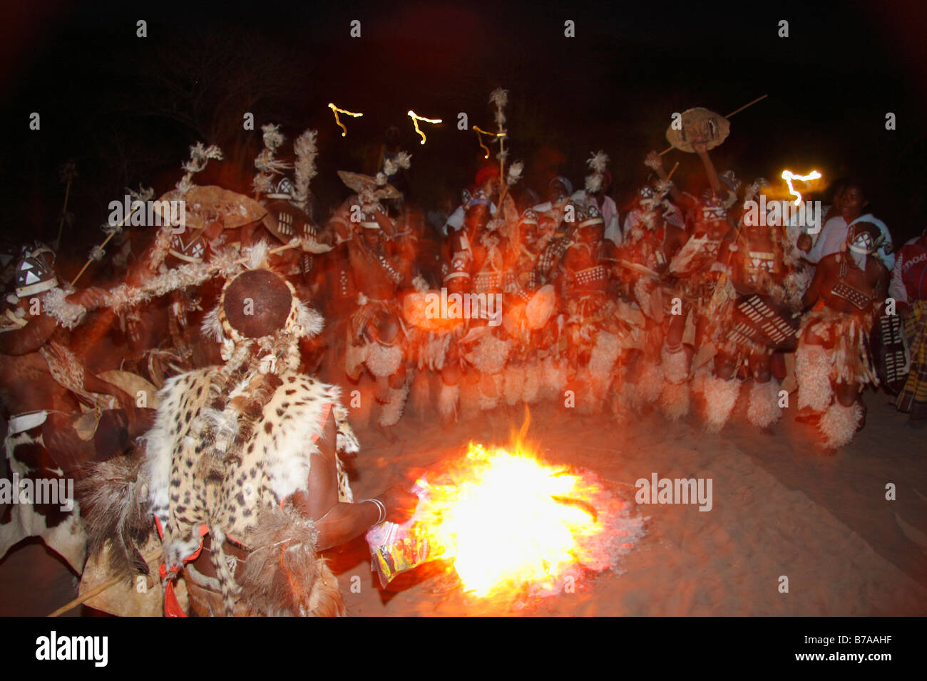 Abstract view of Tonga dancers during an outdoors evening dance performance Stock Photo
