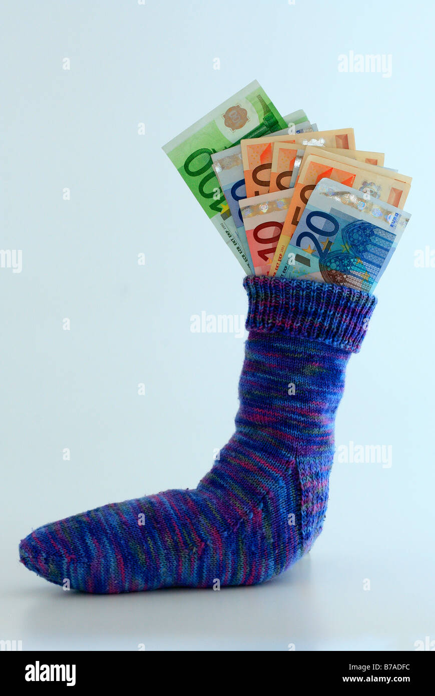 Savings stocking filled with euro notes, alternative to capital investment Stock Photo