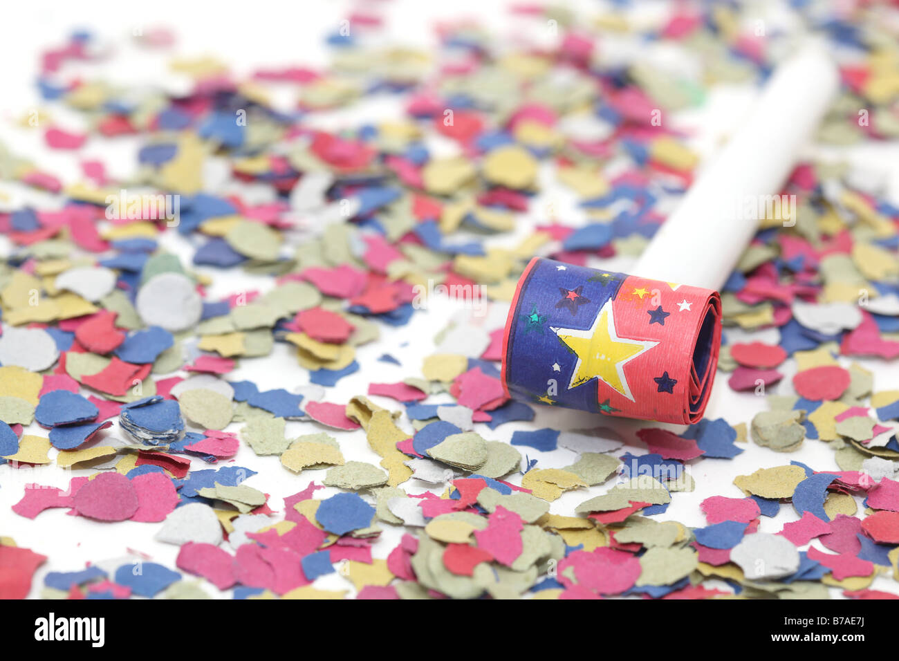celebration and party one blowers on paper confetti Stock Photo - Alamy