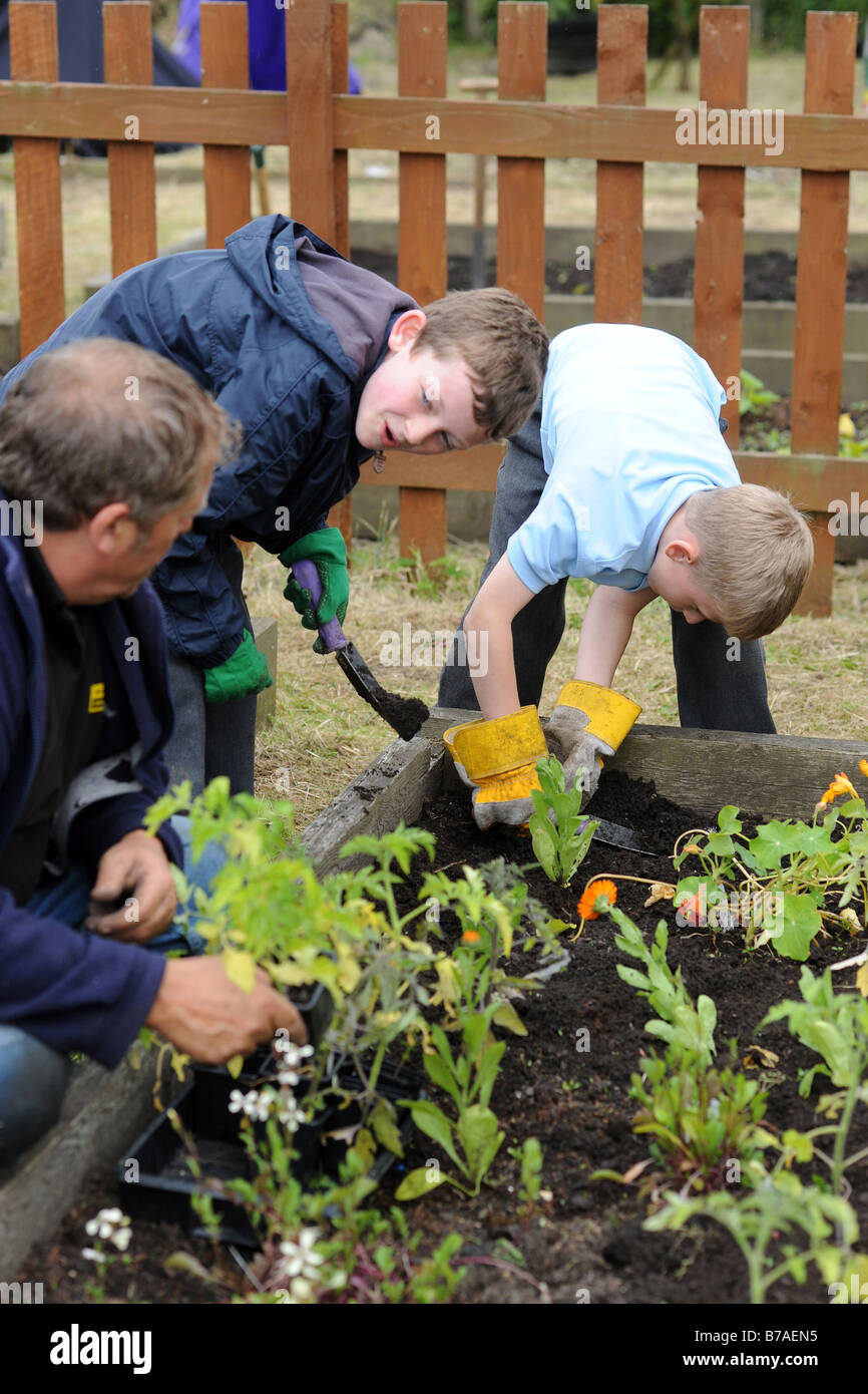 Children visit a local allotment project to learn about gardening and the environment Stock Photo