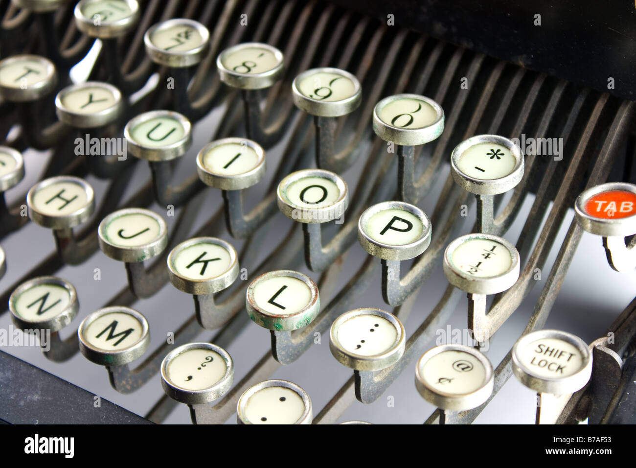 Manual typewriter keyboard with a red tab key Stock Photo