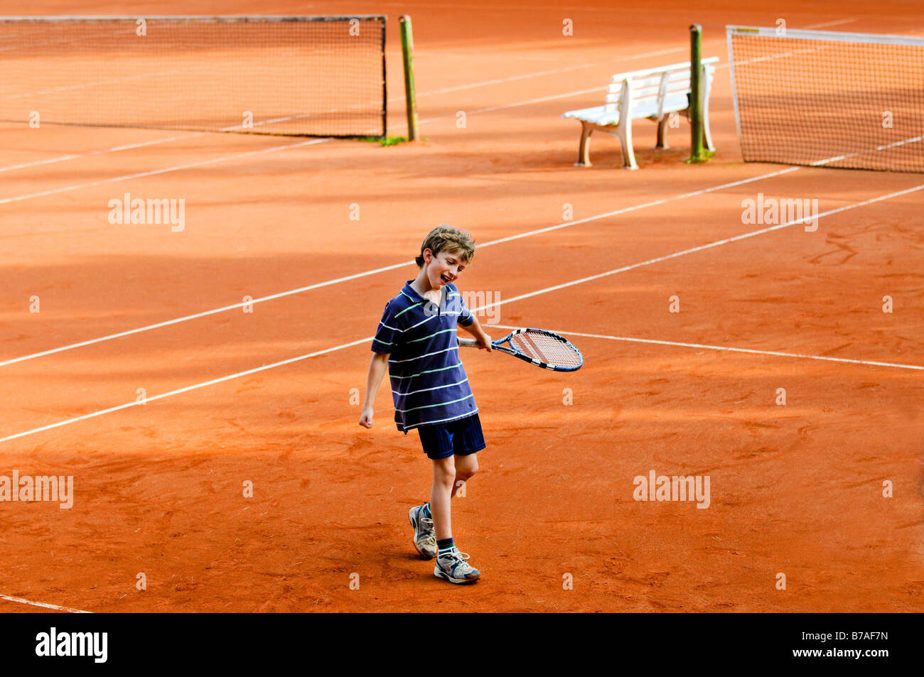 portrait of boy playing tennis Stock Photo