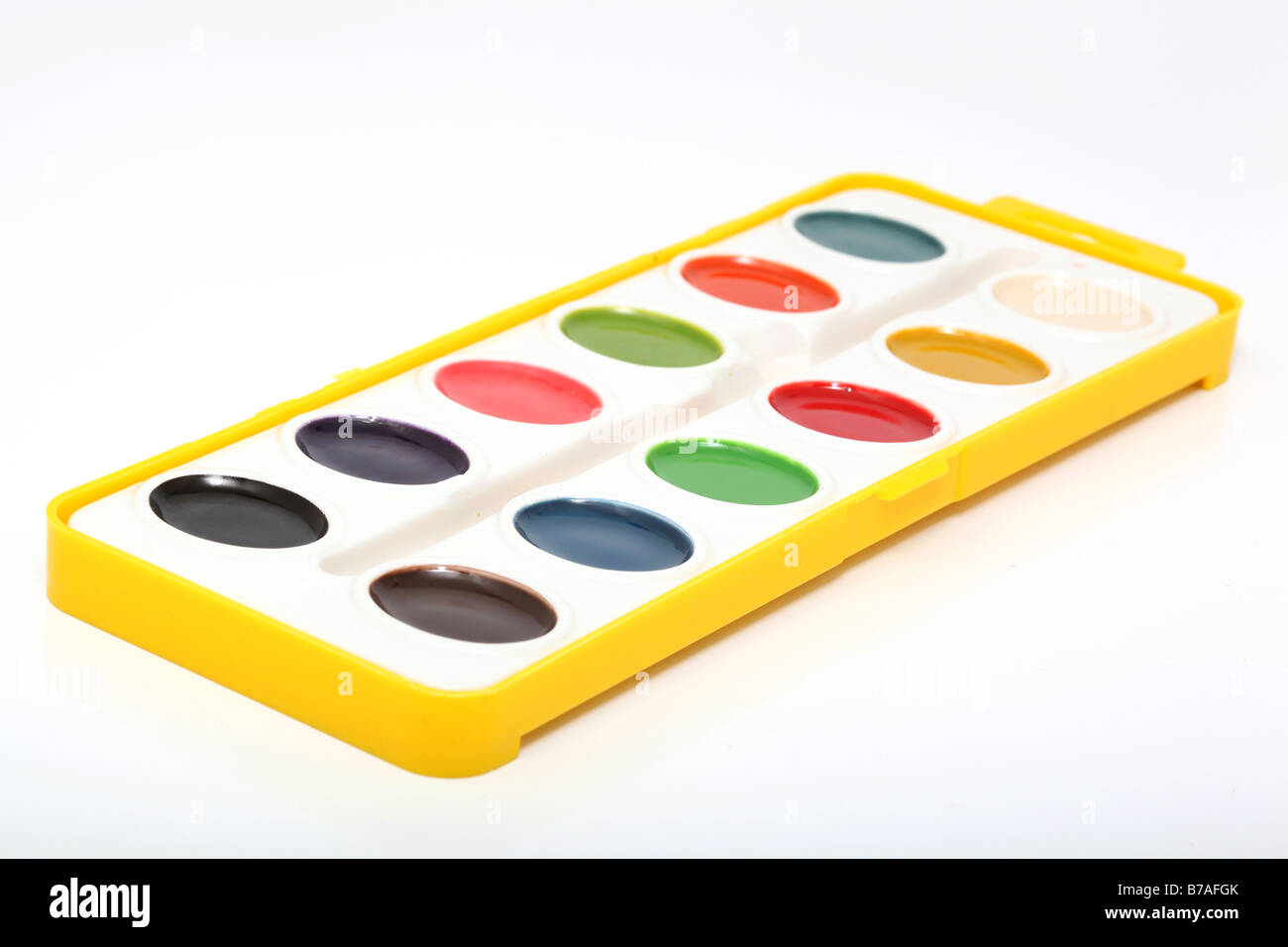 artistic palette variation of watercolors in yellow case Stock Photo