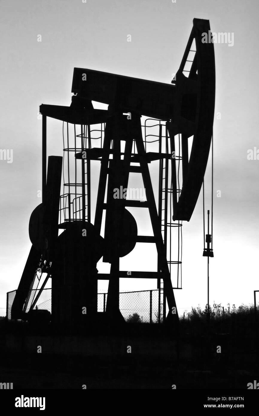 industrial pump jack silhouette b&w Stock Photo