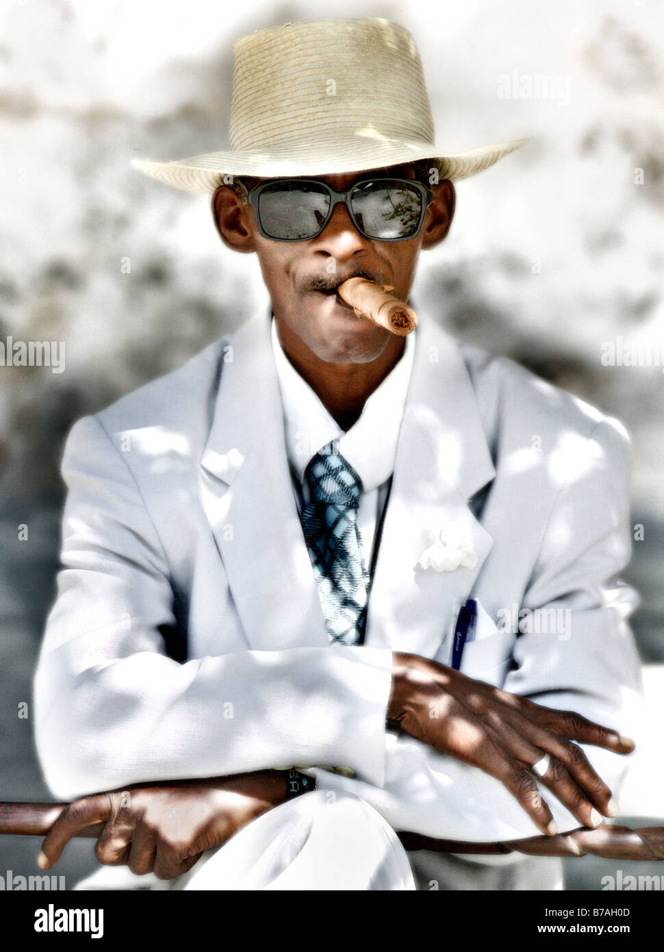 Typical old Cuban man smoking cigar Stock Photo - Alamy