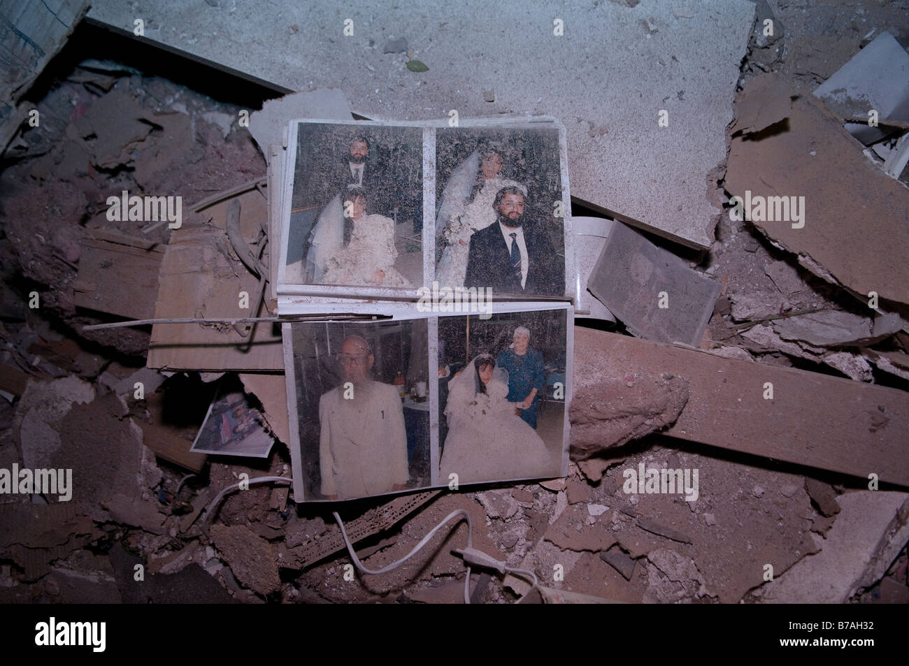 A family photo album sits in a sea of debris after a house was struck by a Palestinian rocket fired from Gaza Strip into Netivot town Israel Stock Photo