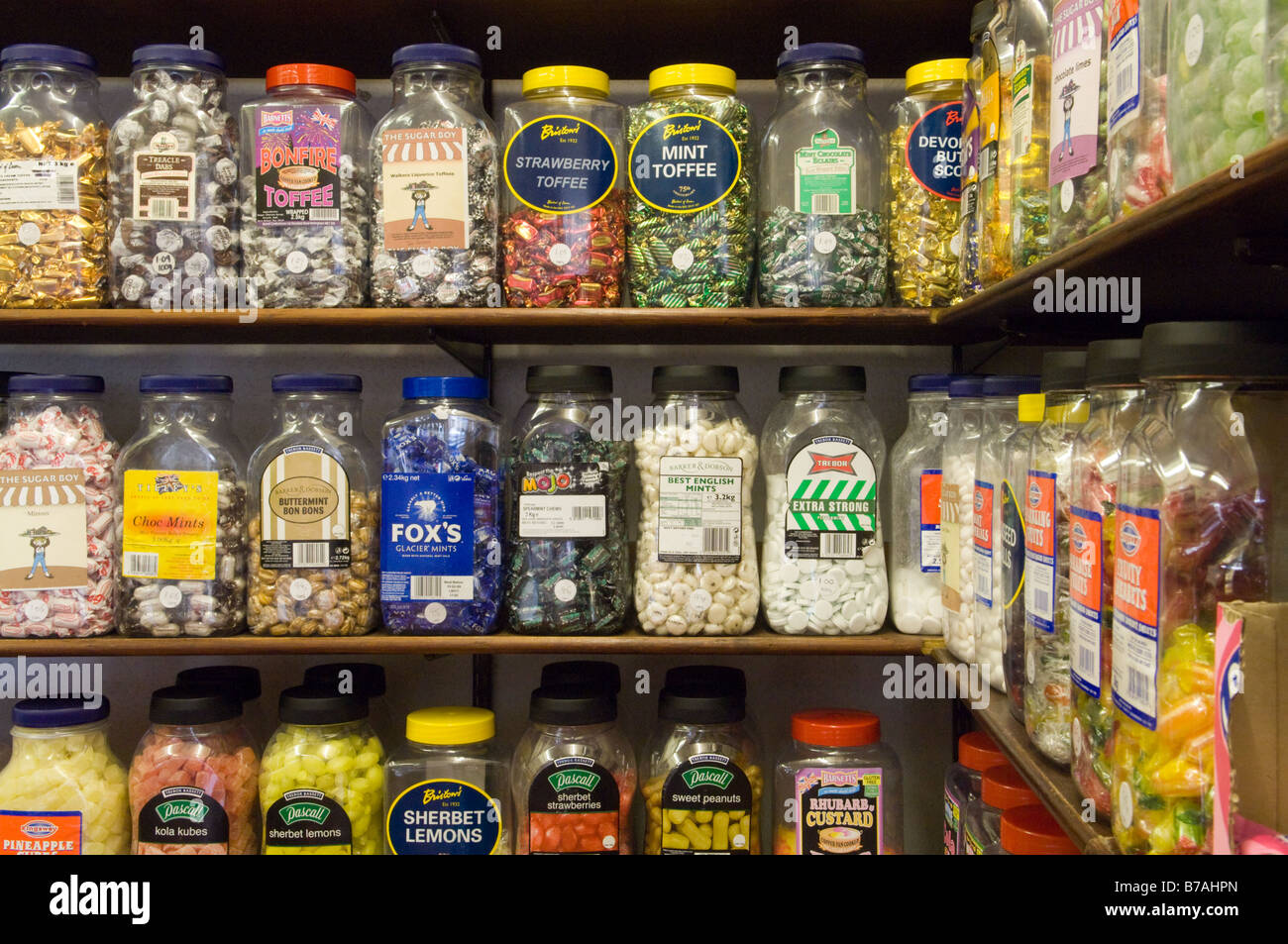 Various jars of sweets for sale in an old fashioned sweet shop displayed in sweet shop jars. Stock Photo