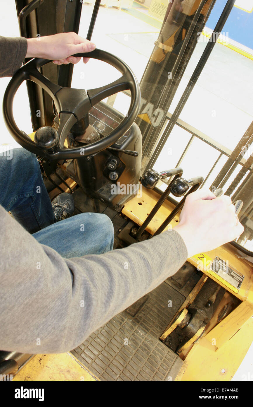 Man At The Controls Of A Forklift Truck Stock Photo Alamy