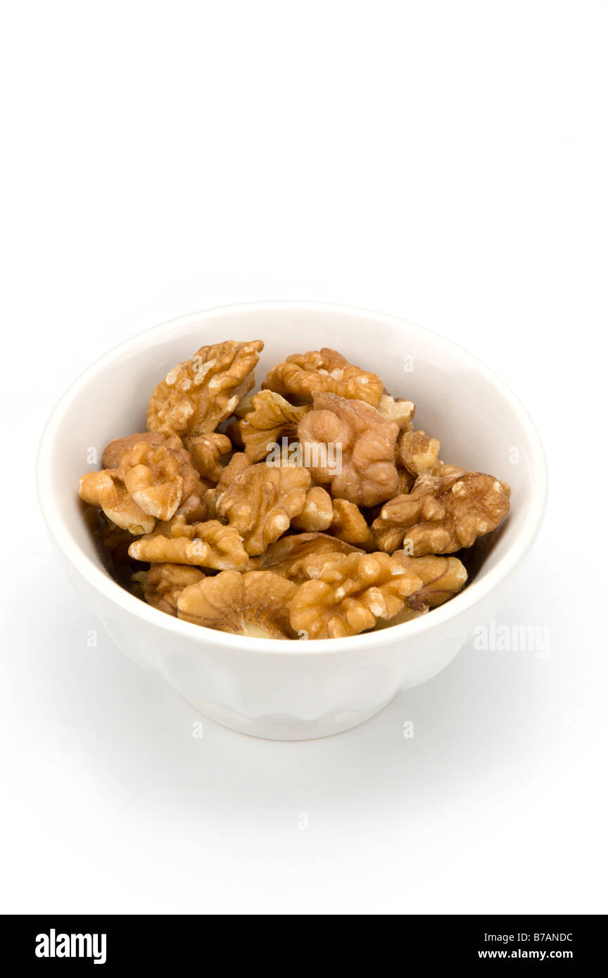 Walnuts in white bowl Stock Photo