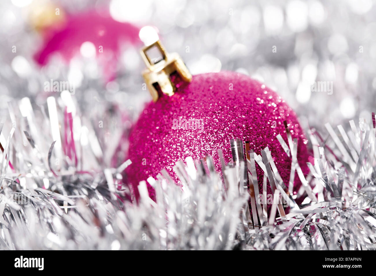 Pink glitter Christmas tree balls with Christmas decorations Stock Photo