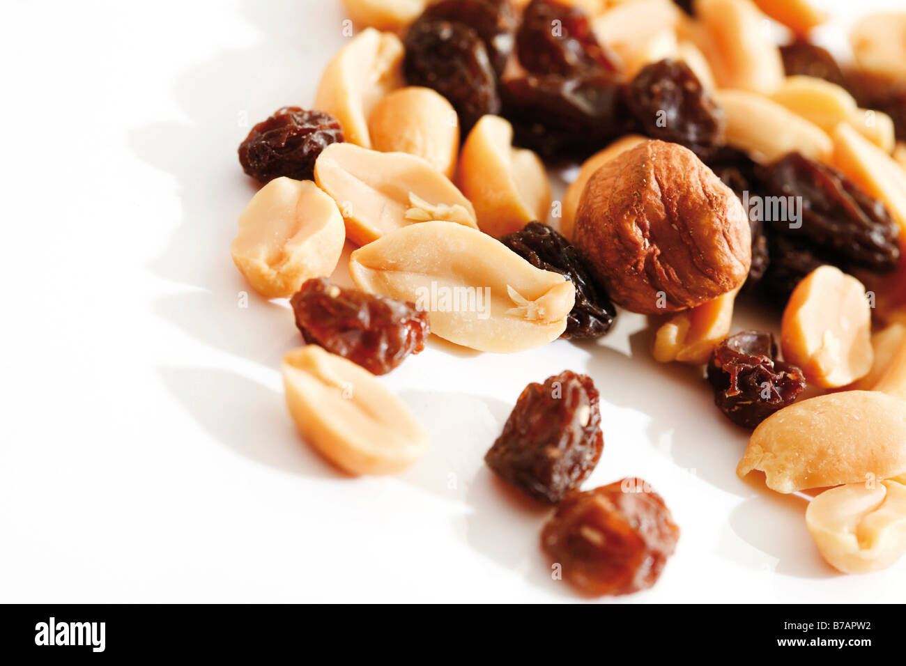 Trail mix, various nuts with raisins Stock Photo