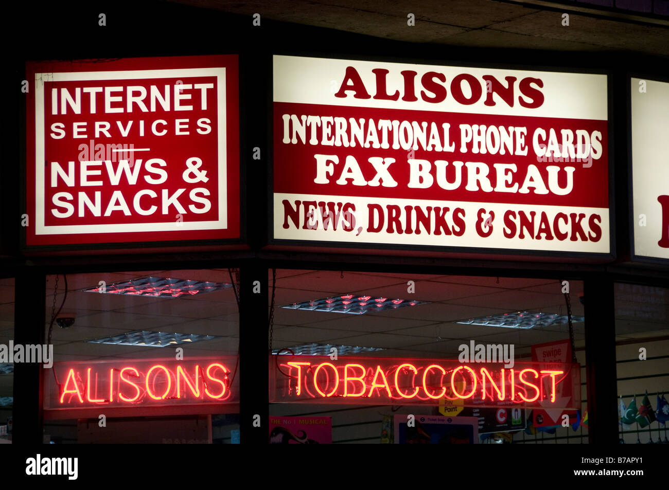 Alisons international phone cards fax bureau news drinks snacks internet services tobacco tabacconist Stock Photo