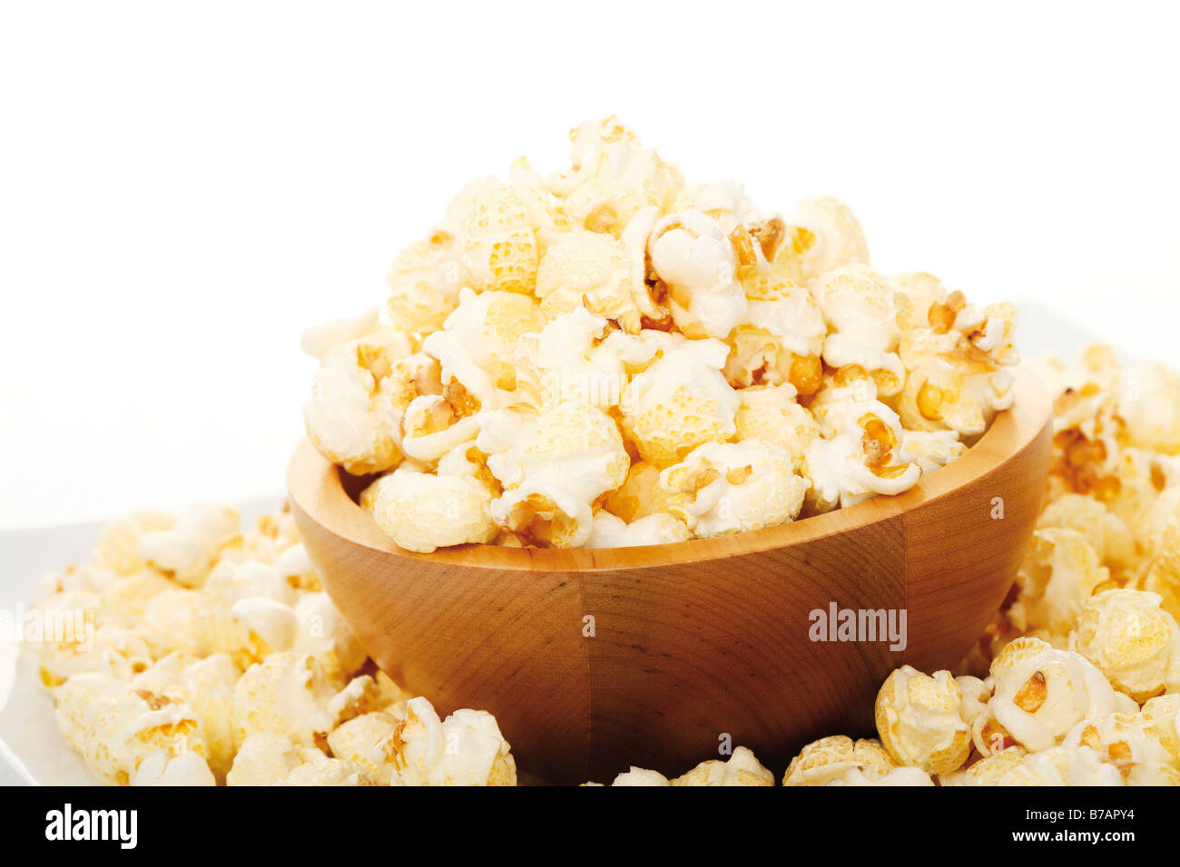 Popcorn in a wooden dish Stock Photo