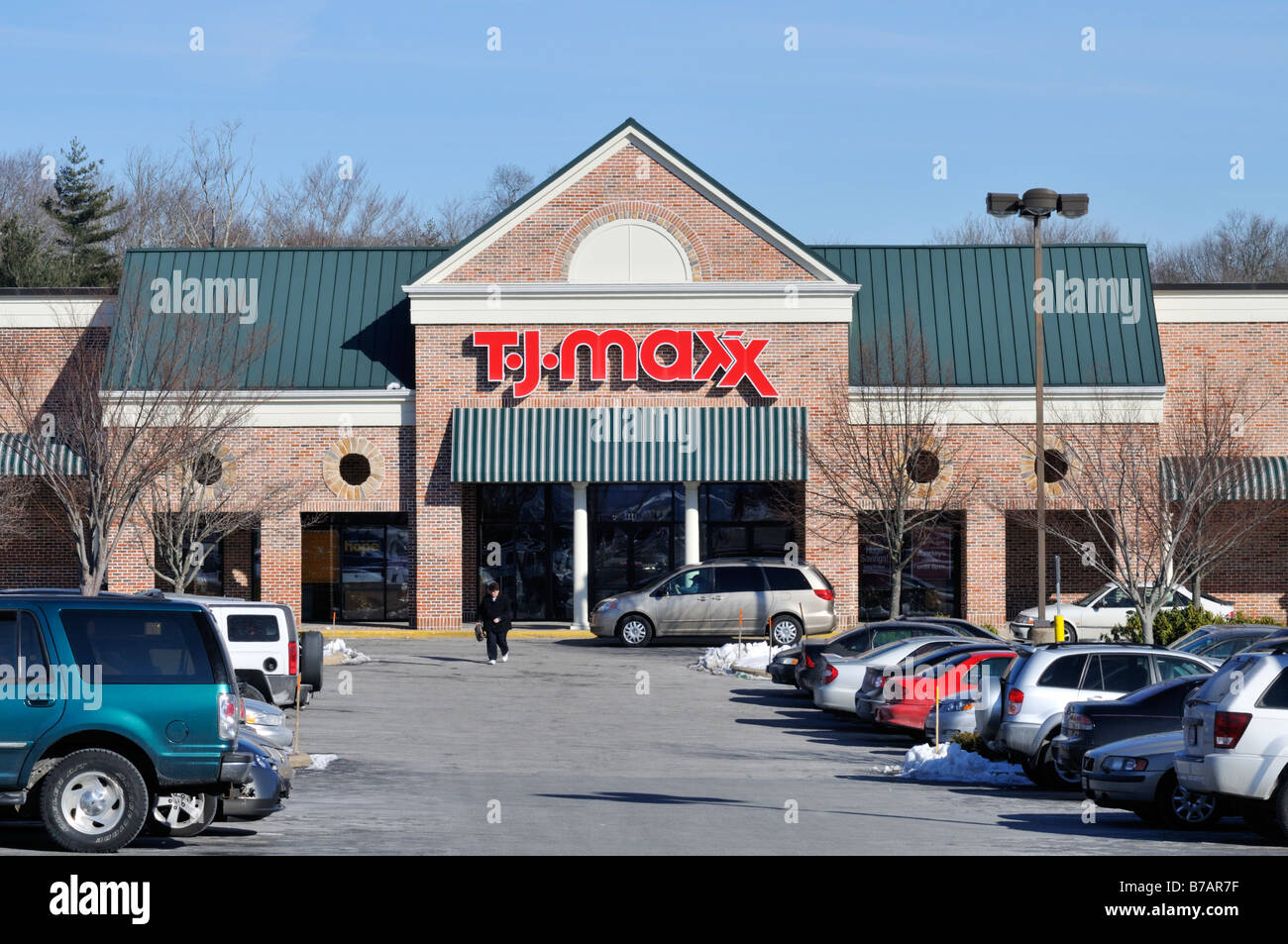 T J Maxx retail storefront with cars in parking lot in USA. Stock Photo