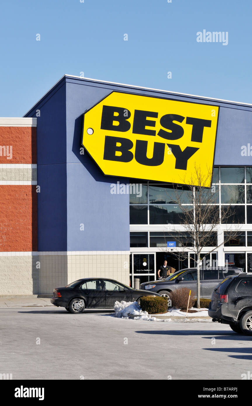 Exterior of Best Buy retail store with sign and logo and cars in parking lot.  United States Stock Photo