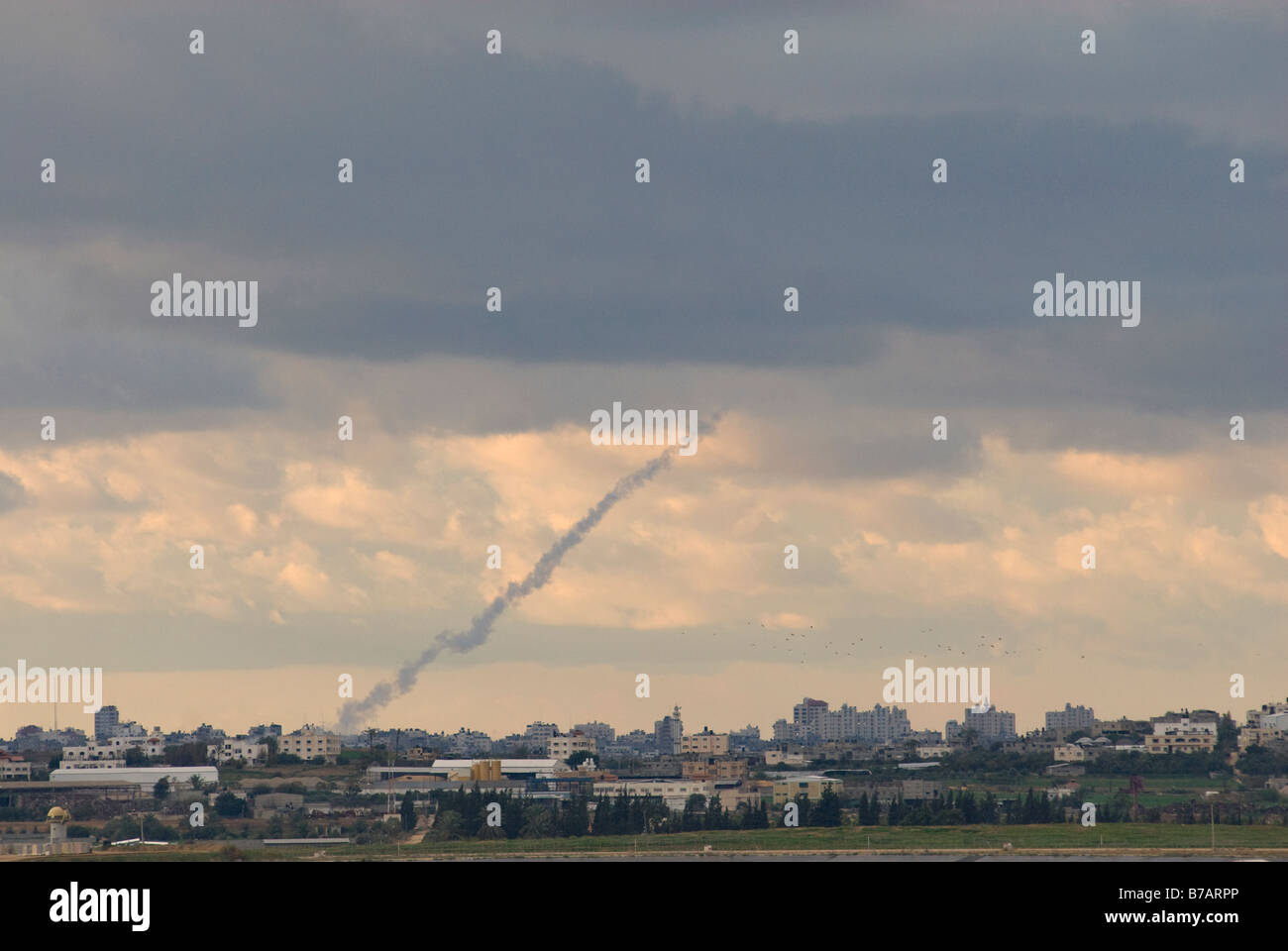 Smoke trail of a Grad rocket launched by Hamas from the Gaza Strip into Israel Stock Photo