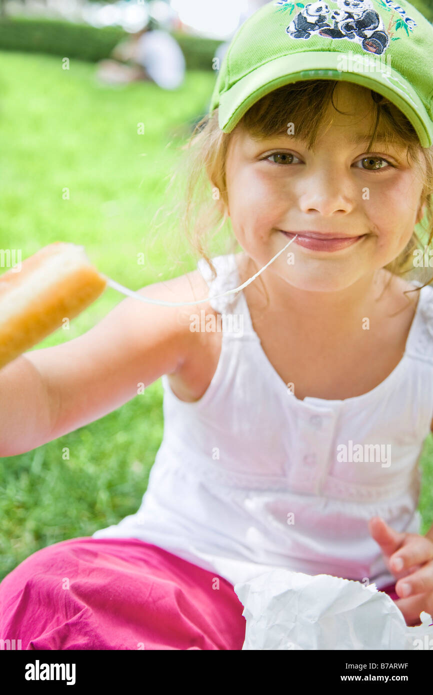 Girl Eating Cheese, Chicago, Illinois, USA Stock Photo