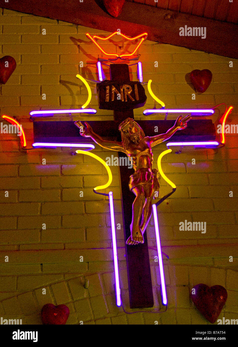 Neon crucifix at Mi Tierra Restaurant bakery and waiting area San Antonio Texas Stock Photo